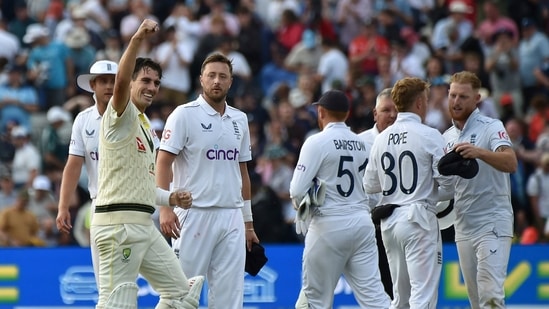 Australia captain Pat Cummins, left, celebrates after beating England during on day five of the first Ashes Test(AP)