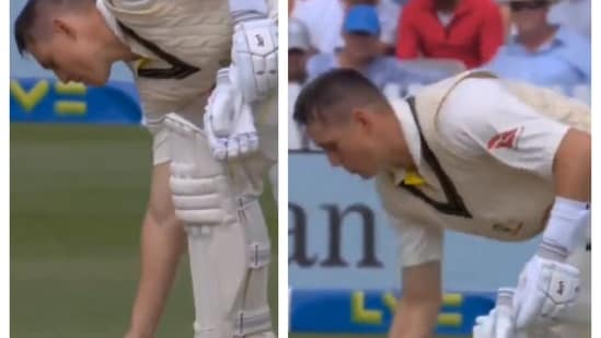 Marnus Labuschagne picking up his chewing gum from the pitch