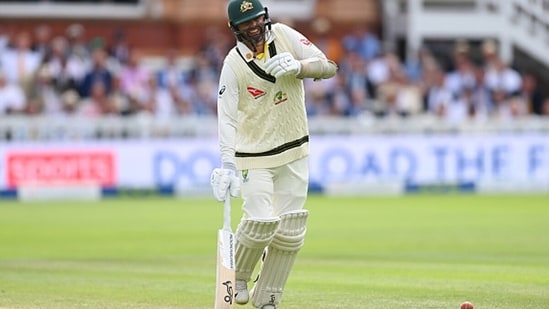 Nathan Lyon grimaces in pain during the 2nd Ashes Test.(Getty)