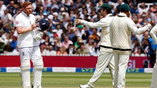 Travis Head points as he talks with Jonny Bairstow during the second Ashes Test(AFP)