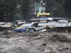 In another incident, six people were evacuated safely by a team of the State Disaster Response Force (SDRF) on Sunday who were trapped in their homes due to the rise in the water in the lower market of Pandoh in the Mandi district of Himachal Pradesh. (HT Photo/Aquil Khan)