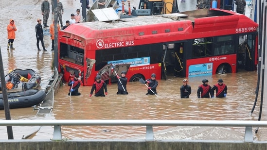 The death toll from days of torrential rain in South Korea rose to 40, including a dozen people found dead in a submerged underpass. (AFP)