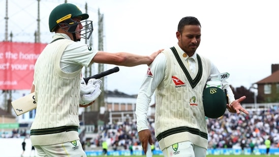 Usman Khawaja and Marnus Labuschagne walk off the field(Reuters)