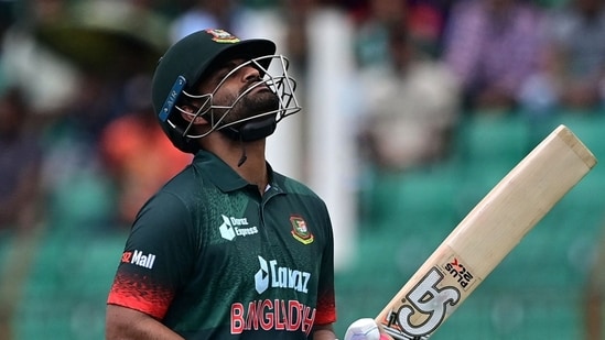 Bangladesh's captain Tamim Iqbal walks back to the pavilion(AFP)