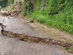 Cracks have developed in the road after heavy rains in Pauri district’s Yamkeshwar area in Uttarakhand. (Hindustan Times)