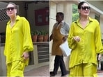 Kareena Kapoor once again displayed her casual styling prowess as she stepped out of her residence in Mumbai today. The paparazzi clicked Kareena outside her home dressed in a neon green satin shirt and parachute pants. It is the perfect Friday casual look. Scroll ahead to check out how she styled the ensemble. (HT Photo/Varinder Chawla)