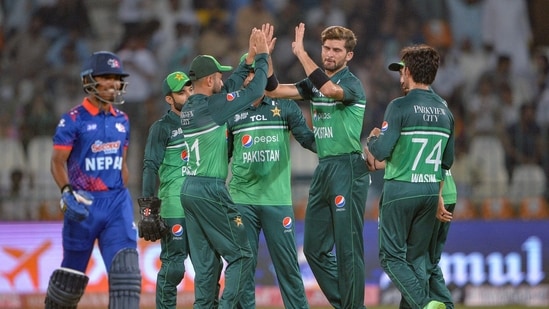 Pakistan's Shaheen Shah Afridi (2R) celebrates with teammates after taking the wicket of Nepal's captain Rohit Paudel (L) during the Asia Cup 2023(AFP)