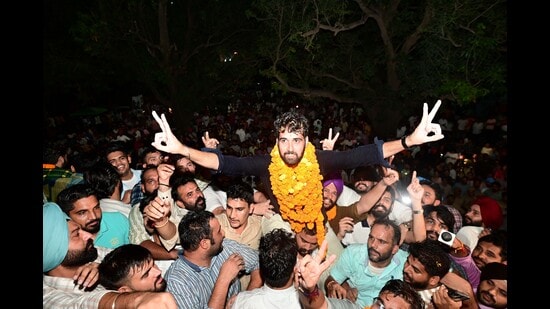 NSUI’s Jatinder Singh celebrating his victory with supporters at Panjab University on Wednesday night. (Ravi Kumar/HT)