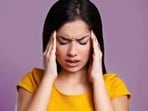 “A migraine headache is a severe type of headache that is accompanied by sensory warning signals such as blind spots, nausea, vomiting, flashes of light, and increased sensitivity to sound and light,” says Dr Dimple Jangda, Ayurveda & gut health coach. She has further shared a few Ayurvedic remedies that can help alleviate pain in her recent Instagram post.(Shutterstock)