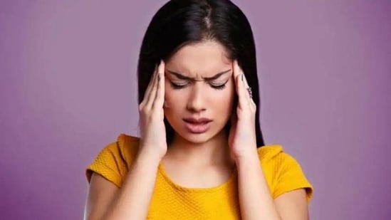 “A migraine headache is a severe type of headache that is accompanied by sensory warning signals such as blind spots, nausea, vomiting, flashes of light, and increased sensitivity to sound and light,” says Dr Dimple Jangda, Ayurveda & gut health coach. She has further shared a few Ayurvedic remedies that can help alleviate pain in her recent Instagram post.(Shutterstock)