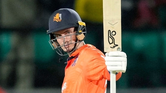 Netherlands skipper Scott Edwards raises his bat as he celebrates his half-century during their match against South Africa(ANI )