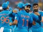 India's skipper Rohit Sharma and Mohammed Shami celebrate after winning the match against Sri Lanka in the ICC Men's Cricket World Cup 2023
