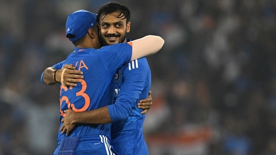 Axar Patel celebrates with Suryakumar Yadav after taking the wicket of Ben McDermott during the fourth T20I between India and Australia(AFP)