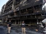 The death toll from the fire, initially at four, has now risen to five as rescue personnel recovered another body from the fire-affected residential building. (AP)