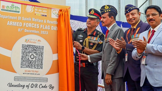 ASC Centre Commandant Lt. General BK with Lt General Venkatesh Reddy, AVSM (retd) and others unveils the QR code for contribution to Armed Forces Flag Day fund during the Armed Forces Flag Day event at Raj Bhavan in Bengaluru.(PTI)