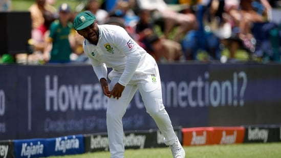 Temba Bavuma reacts in pain while fielding during the first day of the first cricket Test match between South Africa and India at SuperSport Park in Centurion(AFP)