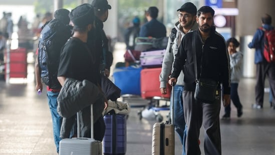 Passengers from Nicaragua-bound Airbus A340 flight that was grounded in France on suspicion of human trafficking, leave the Chhatrapati Shivaji Maharaj International Airport after their arrival in Mumbai on December 26. (REUTERS)