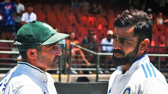 India's Virat Kohli interacts with retiring Dean Elgar after gifting a signed jersey on behalf of Team India (ICC - X)