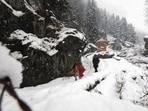 Tourists enjoy snow covered Drang area of Tangmarg, about 50kms from Srinagar on Wednesday.(HT Photo/Waseem Andrabi)