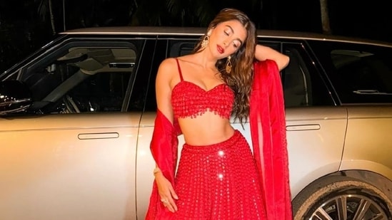 Pooja Hegde's recent wedding season sartorial picks should be on your radar. The actor has been updating her Instagram followers with the stunning attires she has donned in the shaadi season - from lehengas to sarees and embellished gowns. Pooja's most recent post on social media shows her dressed in a red hand-embroidered lehenga set. Scroll down to check out the ensemble and find its cost. (Instagram)