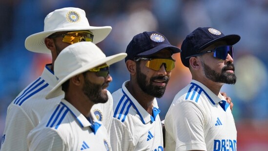 India's Mohammed Siraj, right, leaves the field with Jasprit Bumrah, second right, and other teammates at the end of England's first innings in Rajkot(AP)