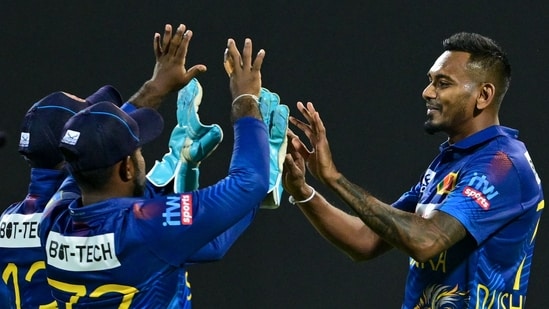 Sri Lanka's Dushmantha Chameera (R) celebrates with teammates after taking the wicket of Afghanistan's Gulbadin Naib(AFP)