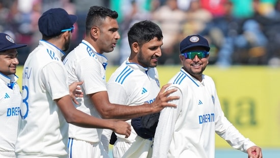 Ravichandran Ashwin (3rd from left) pushes Kuldeep Yadav (right) to lead the Indian team following end of England's 1st innings in the Dharamsala Test(PTI)