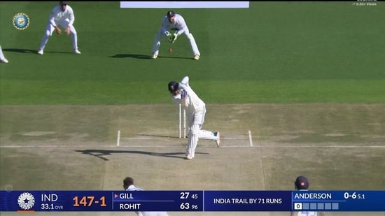 Shubman Gill charges down he track to hit Anderson for a six