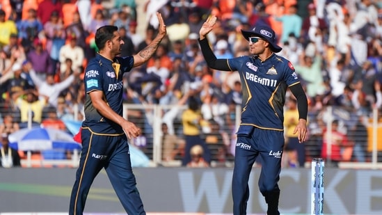 Gujarat Titans' captain Shubman Gill and Mohit Sharma celebrate a wicket.(ANI)