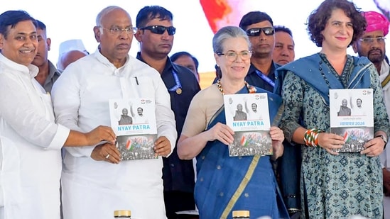 Congress President Mallikarjun Kharge, CPP Chairperson Sonia Gandhi, party General Secretary Priyanka Gandhi Vadra and others during the launch of the 'Congress Manifesto' during a public rally ahead of the Lok Sabha elections, in Jaipur on Saturday. Former Rajasthan CM Ashok Gehlot and party leader Sachin Pilot were also present.(ANI)