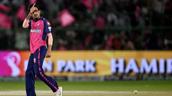 Rajasthan Royals' Yuzvendra Chahal celebrates after taking the wicket of Gujarat Titans' captain Shubman Gill.(AFP)