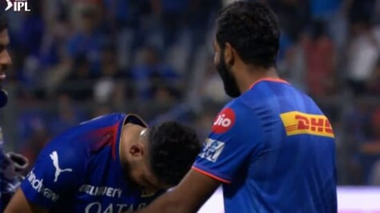 Mohammed Siraj (L) bows down to Jasprit Bumrah after MI vs RCB match(IPL)