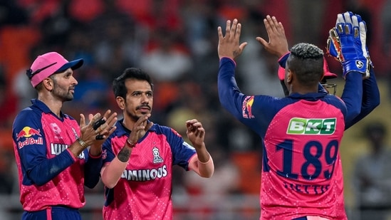 Rajasthan Royals' Yuzvendra Chahal (2L) celebrates a wicket.(AFP)