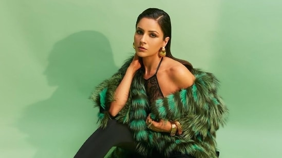 Shehnaaz Gill took to Instagram to share pictures from a new sizzling photoshoot and delighted her fans with a sensuous avatar. The photos show Shehnaaz in a black lacy embroidered bralette, pantashoes and a faux fur coat. The actor captioned the post, 