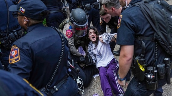 Pro-Palestinian protesters are pushed to the edge of campus at the University of Texas Wednesday, April 24, 2024, in Austin, Texas. Student protests over the Israel-Hamas war have popped up on an increasing number of college campuses following last week's arrest of more than 100 demonstrators at Columbia University. (Ricardo B. Brazziell/Austin American-Statesman via AP)(AP)