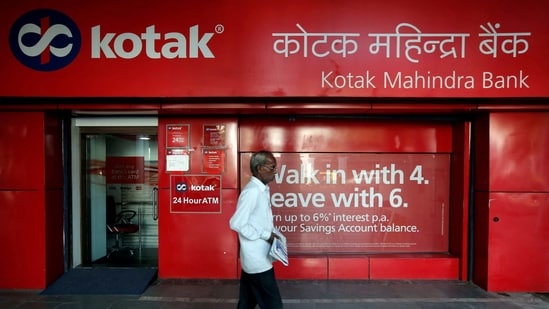 FILE PHOTO: A man walks past the Kotak Mahindra Bank branch in New Delhi, India, September 6, 2017. REUTERS/Adnan Abidi/File Photo(REUTERS)