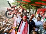 Samajwadi Party (SP) Chief Akhilesh Yadav holds a bicycle during a rally, in Hardoi, Uttar Pradesh.(ANI)