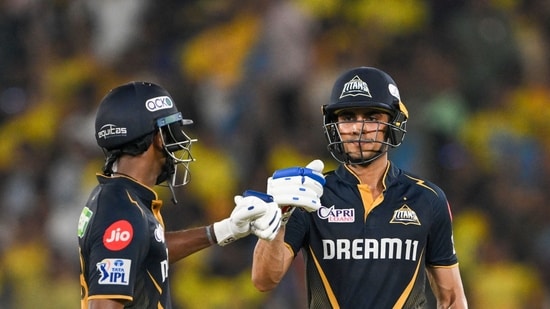 Gujarat Titans' captain Shubman Gill (R) and teammate Sai Sudharsan bump fists during the Indian Premier League (IPL) Twenty20 cricket match between Gujarat Titans and Chennai Super Kings (AFP)