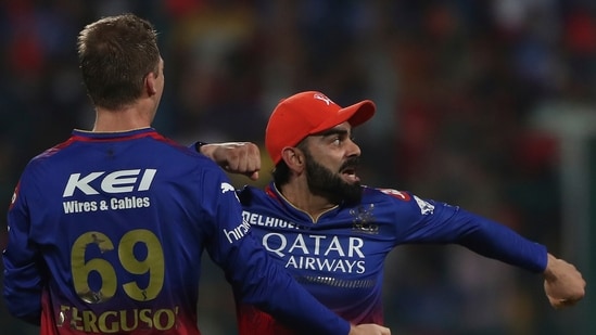 Royal Challengers Bengaluru's Virat Kohli, right, celebrates the dismissal of Delhi Capitals' Jake Fraser-McGurk during the Indian Premier League match.(AP)