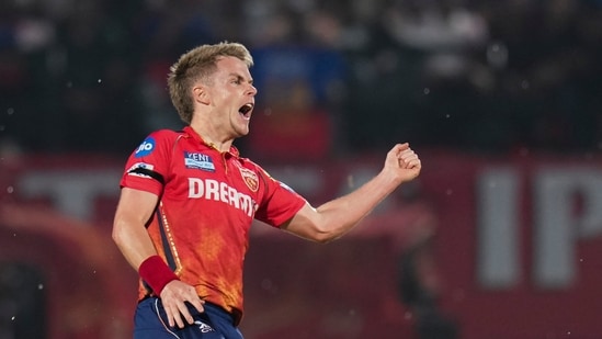 Punjab Kings captain Sam Curran celebrates the wicket of Royal Challengers Bengaluru's Rajat Patidar (PTI)