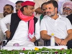 Congress leader Rahul Gandhi with Samajwadi Party (SP) chief and party candidate from Kannauj constituency Akhilesh Yadav during a public meeting, in Amethi, Uttar Pradesh.(PTI)