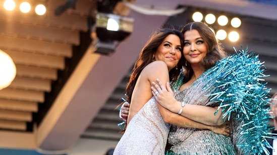 Aishwarya Rai Bachchan (R) poses with US actress, producer, director Eva Longoria as they arrive for the screening of the film Kinds Of Kindness at the 77th edition of the Cannes Film Festival in Cannes on Friday.(AFP)