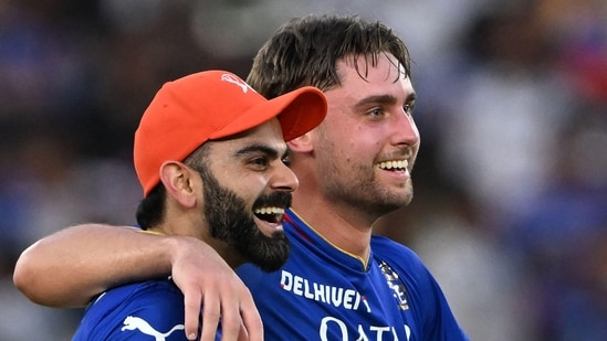 Royal Challengers Bengaluru's Virat Kohli and Will Jacks (R) celebrate their team's win in the Indian Premier League match against Gujarat Titans.(AFP)