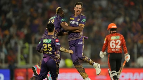 Kolkata Knight Riders' Mitchell Starc celebrates with teammates after the dismissal of Sunrisers Hyderabad's Travis Head.(AP)