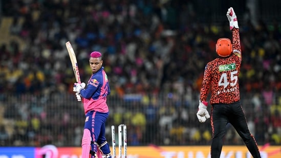 Rajasthan Royals' Shimron Hetmyer (L) is clean bowled as Sunrisers Hyderabad's wicketkeeper Heinrich Klaasen celebrates his dismissal.-(AFP)