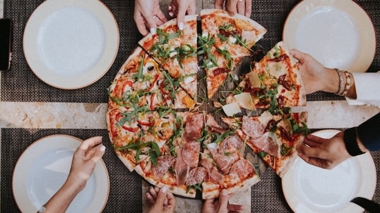 Iconic pizza places in Naples not only define the city's pizza heritage but are also expanding globally, making it likely you'll encounter their delicious offerings even outside of Italy.(Unsplash)