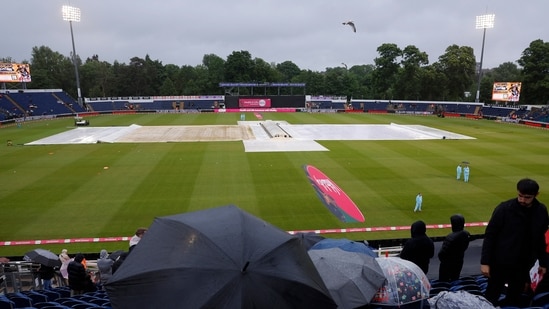 England vs Pakistan: Spectators sit with umbrellas in the stand as rain plays spoilsport in Cardiff(Action Images via Reuters)