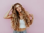 Beautiful hair starts with healthy habits. Want to ensure that your locks are strong and vibrant? In an interview with Zarafshan Shiraz of HT Lifestyle, Dr Charu Sharma, Co-Founder and Director of Dermatology at Cureskin, addressed some common mistakes that people should avoid - (Photo by averie woodard on Unsplash)