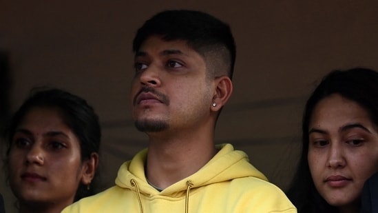 Sandeep Lamichhane looks on outside Patan High Court in Lalitpur district of Kathmandu on May 15, 2024, after his acquittal by the court in a rape case.(AFP)