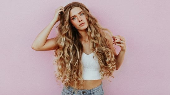 Beautiful hair starts with healthy habits. Want to ensure that your locks are strong and vibrant? In an interview with Zarafshan Shiraz of HT Lifestyle, Dr Charu Sharma, Co-Founder and Director of Dermatology at Cureskin, addressed some common mistakes that people should avoid - (Photo by averie woodard on Unsplash)